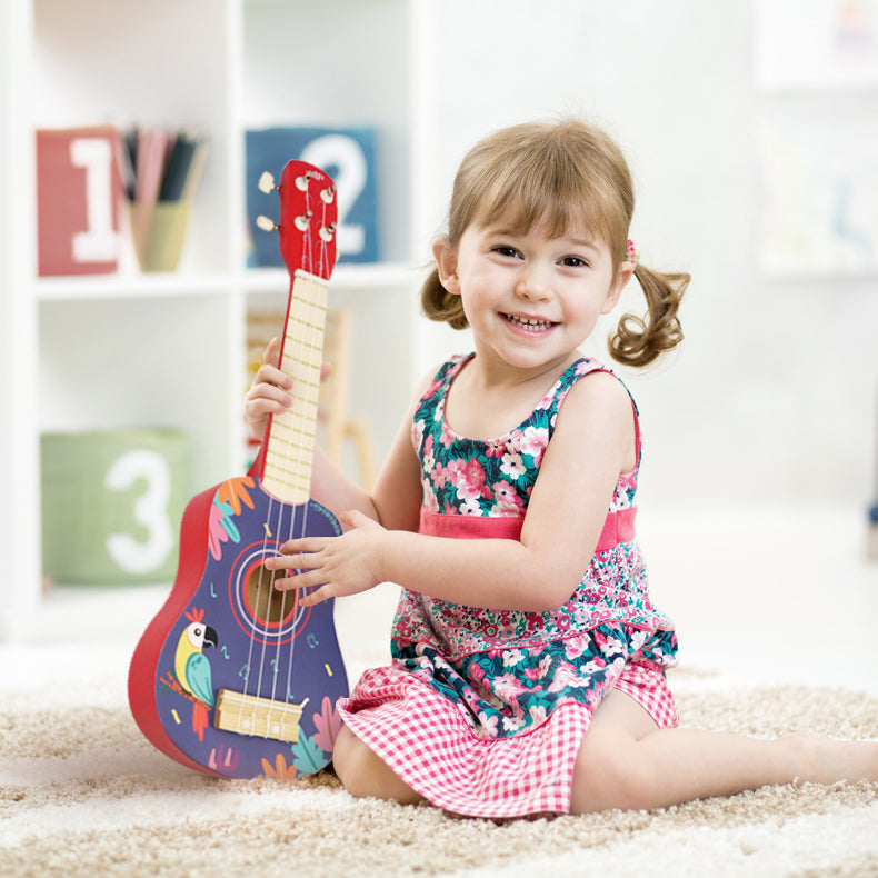 Leo & Friends Wooden Ukulele for Toddlers | Made with Non-Toxic Wood, Colorful Red & Purple Design with Parrots | Perfect Educational Music Toy for Girls and Boys, Includes Strings for Strumming